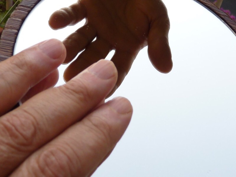 Mirror with large and small hand