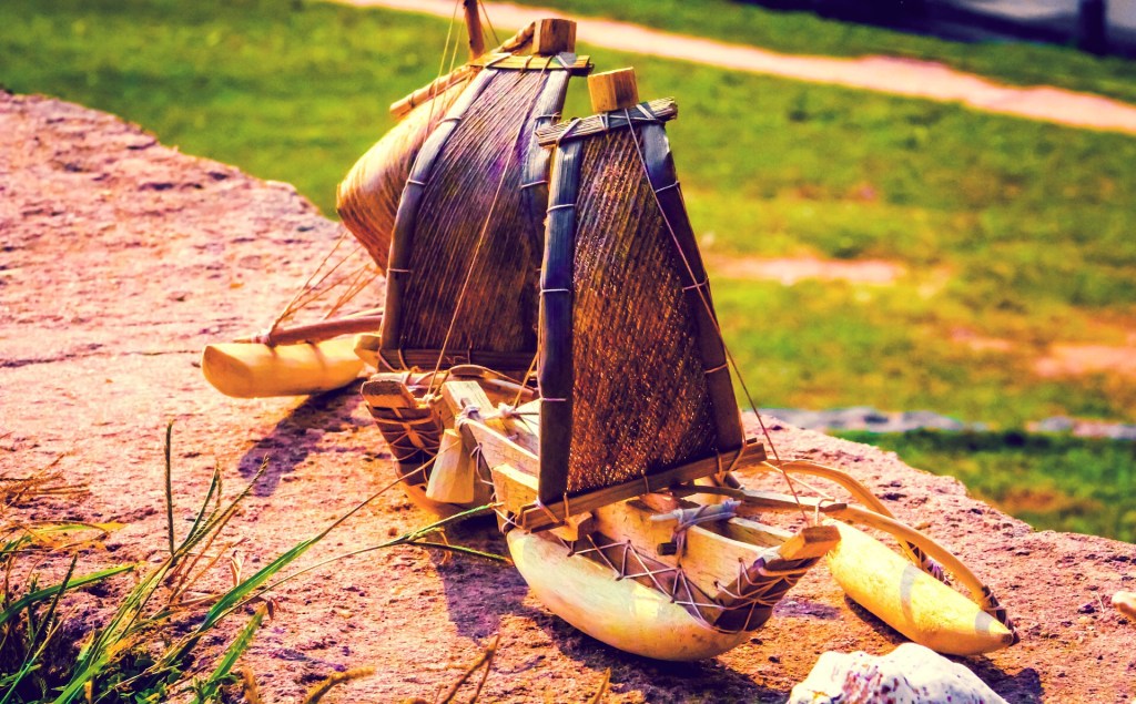 Three bamboo boats on the ground