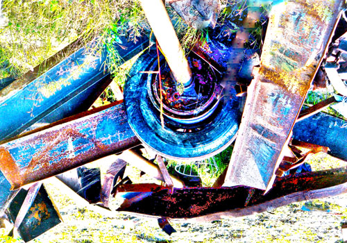 Over-exposed / false-colour image of junk outside, grass nearby